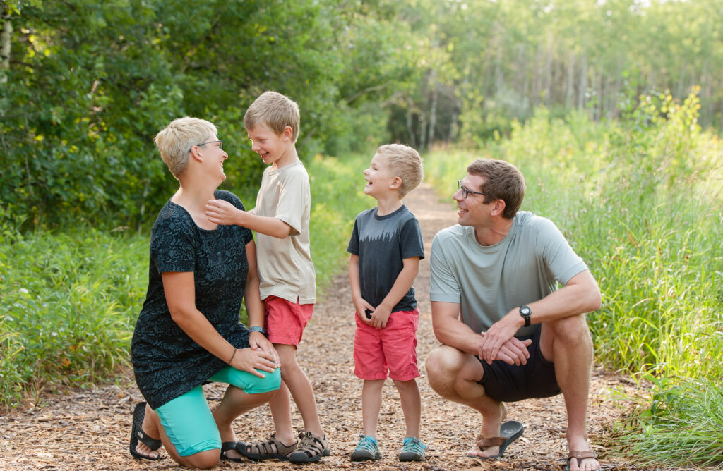 Parents and two kids in a trail - family travel

